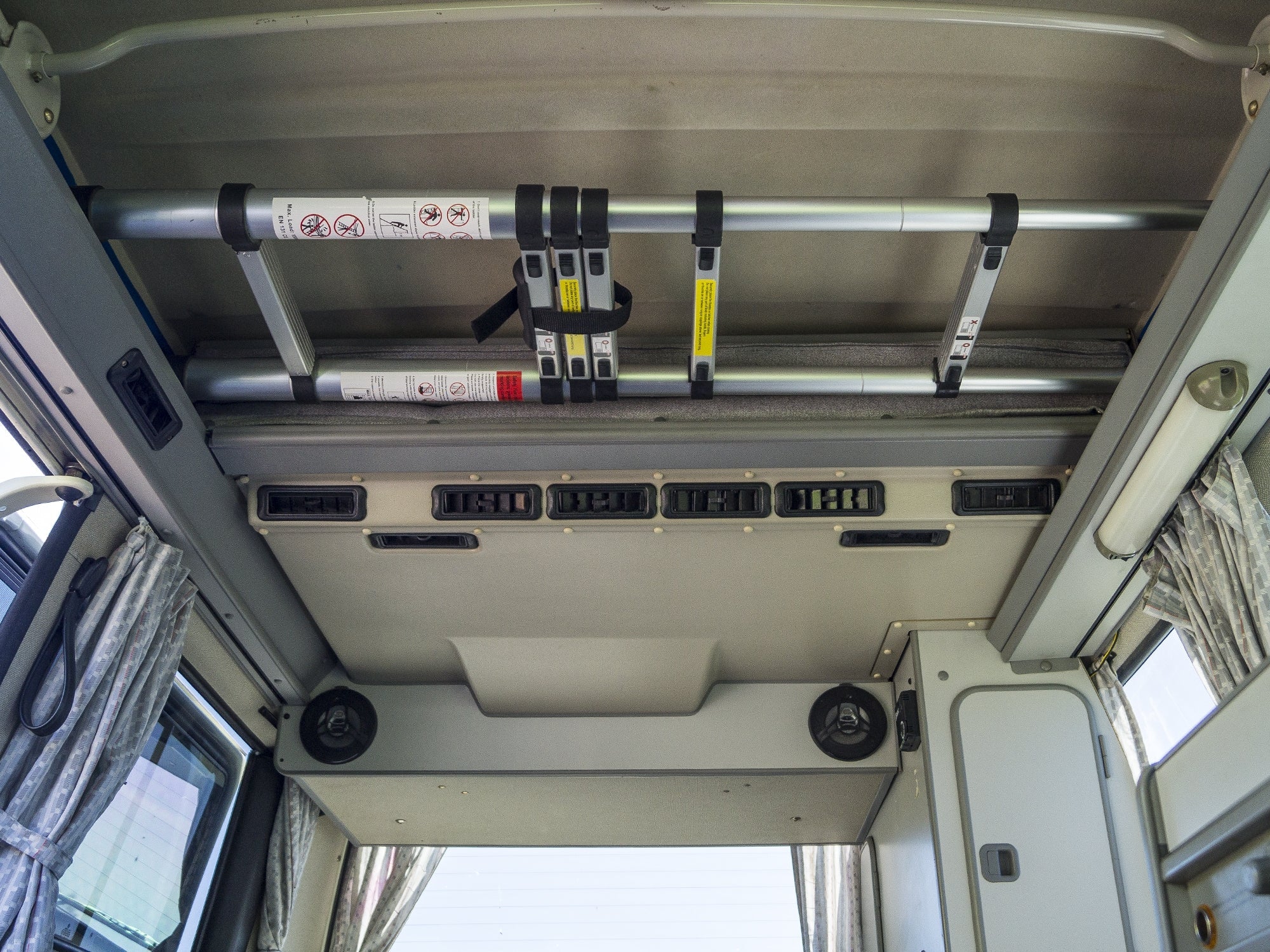 GoWesty telescoping ladder extended outdoors, showing its lightweight, compact design ideal for exterior home or vehicle access.