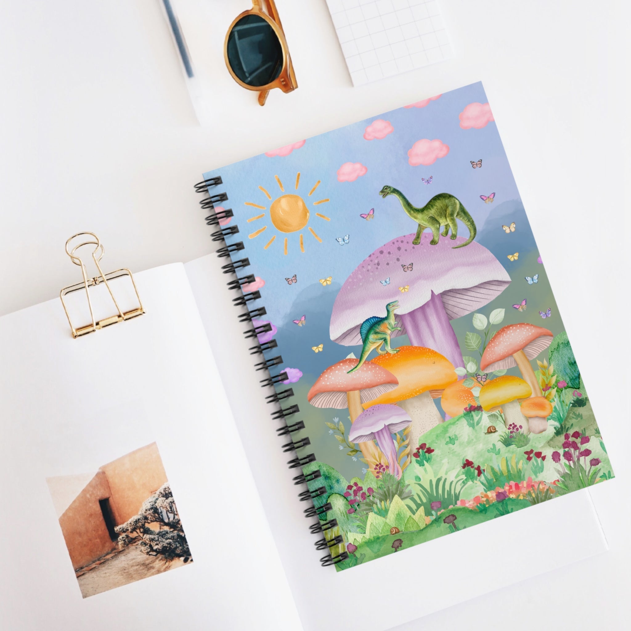 Funny dinosaur spiral notebook with mushroom illustrations and lined pages, ideal for note-taking and creative writing.