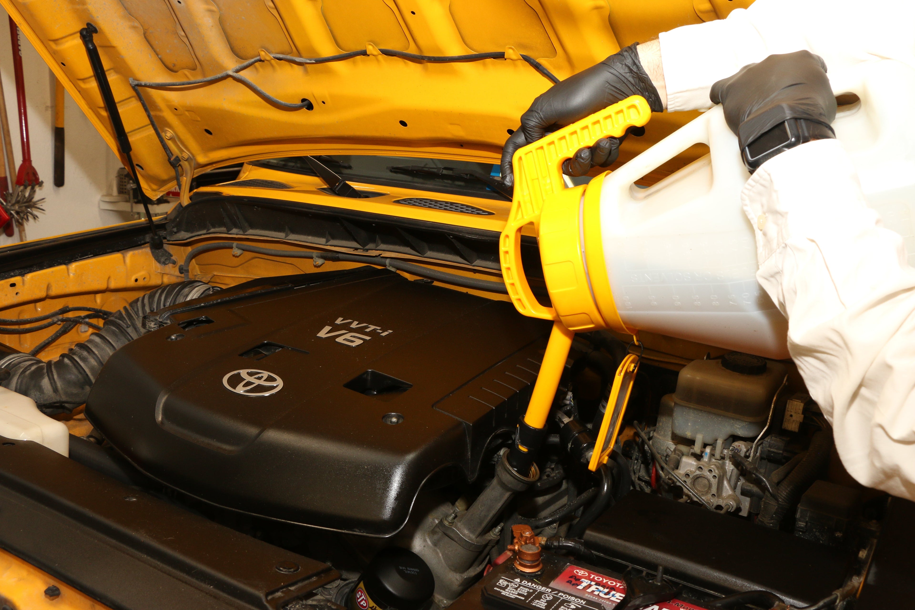 OilSafe Mini Stretch Spout lid for low-flow oil transfer, designed for fluid storage and transfer in racing and automotive applications.