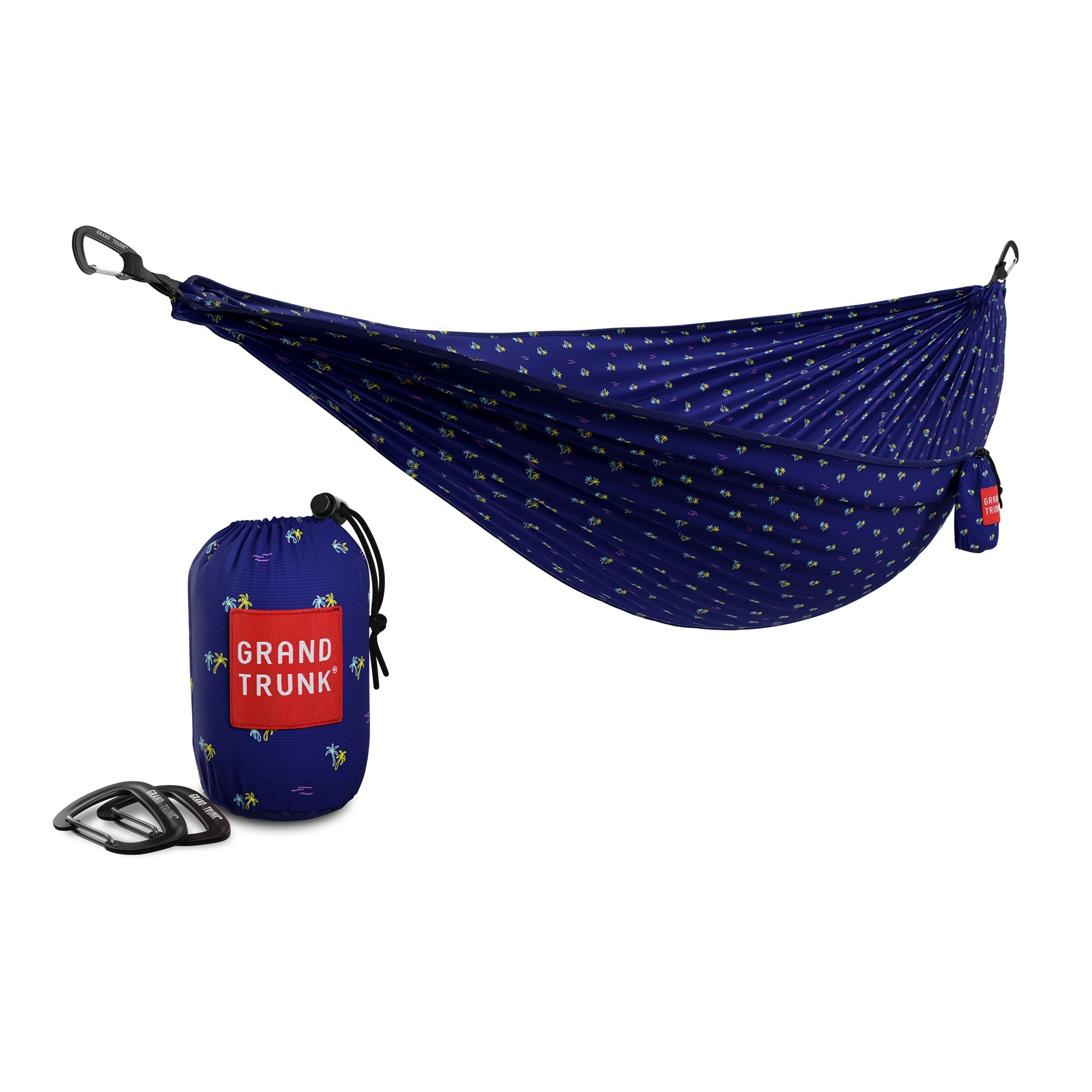 GrandTrunk TRUNKTECH™ hammock hanging between trees, showcasing durable fabric and comfortable design for outdoor relaxation.