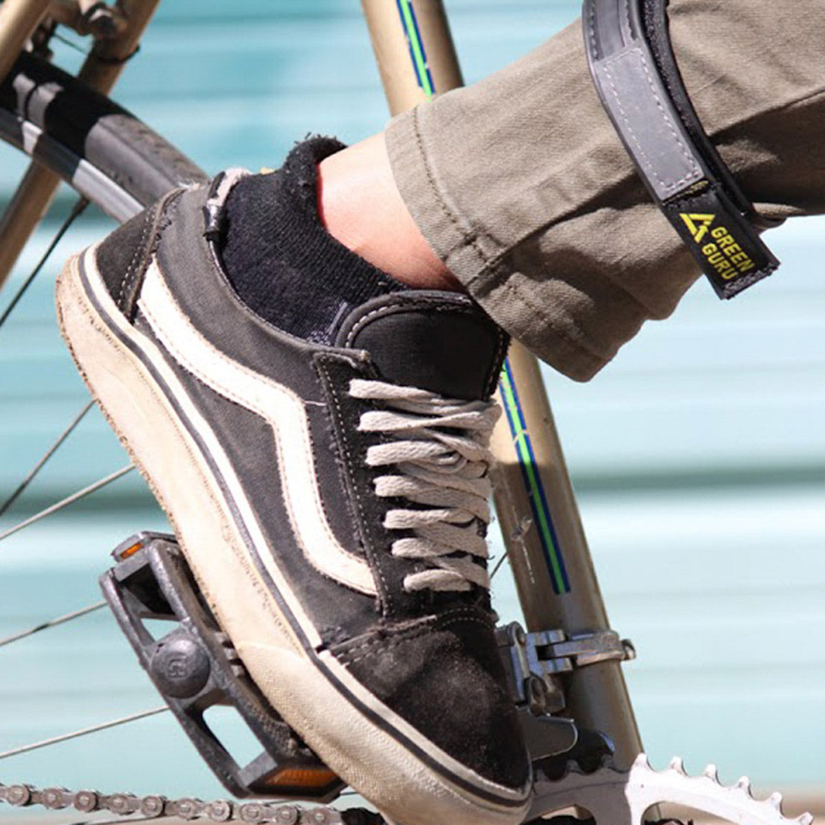 ZEITBIKE Green Guru Narrow Ankle Strap worn on a bicycle pedal for secure foot placement and enhanced riding comfort.