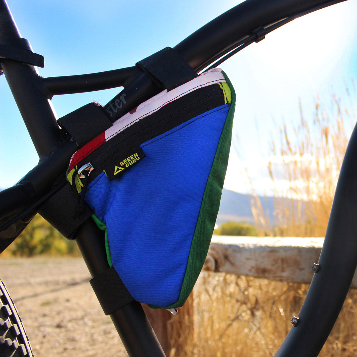 Green Guru Gripster Triangle Frame Bag in use on a bicycle, medium size, designed for bike frames, by ZEITBIKE, in vibrant green.