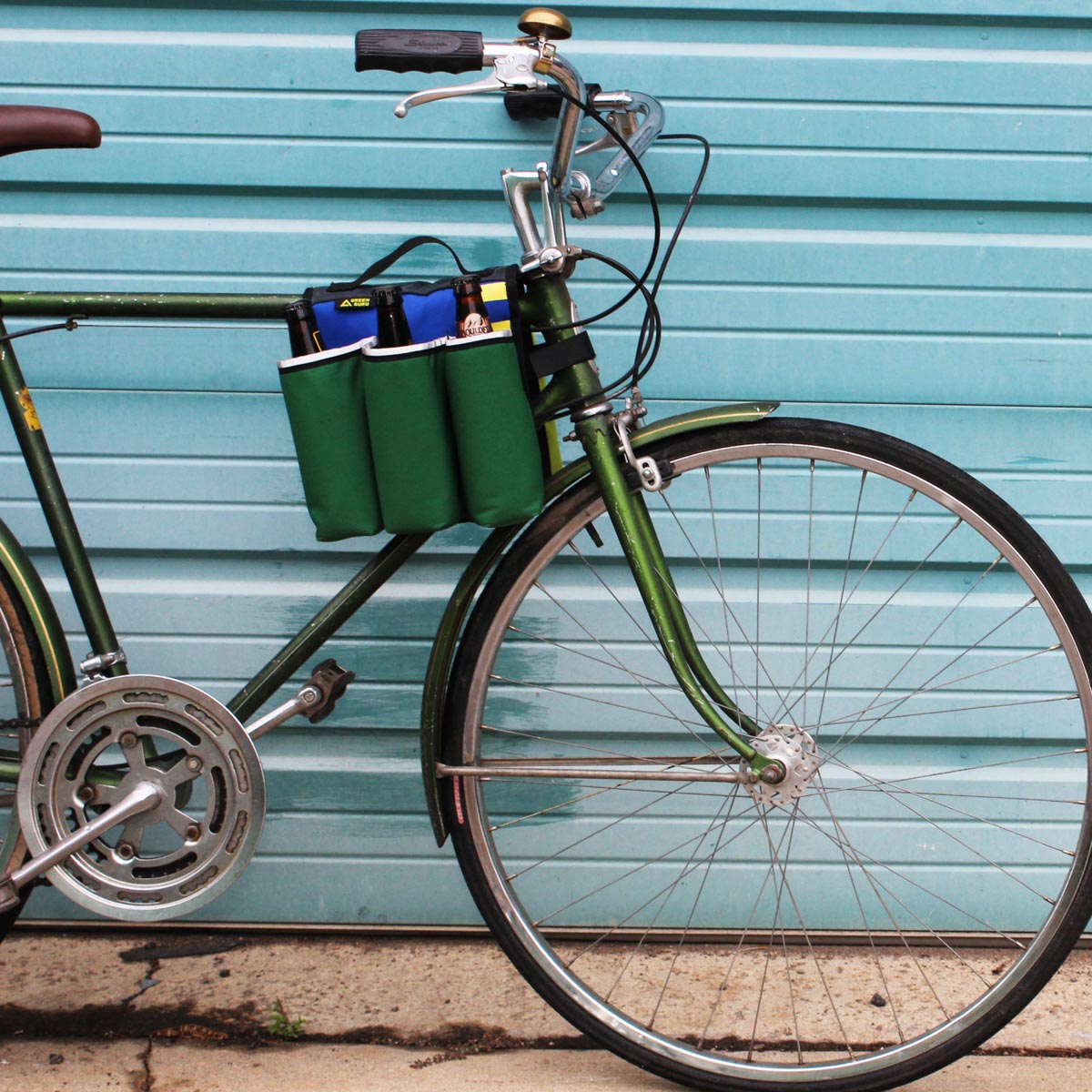 Green Guru Sixer 6-Pack Bottle Holder from ZEITBIKE, stylish multi-color bag designed for carrying bottles on bikes.
