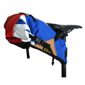 Green Guru Hauler Bike Pack saddle and messenger bag mounted on a bike, showcasing its durable design and vibrant green color.