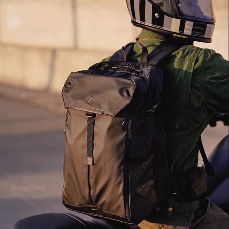 GYXX™ Zues expandable motorcycle backpack by Bean's Moto Booth, shown with adjustable straps and multiple compartments.