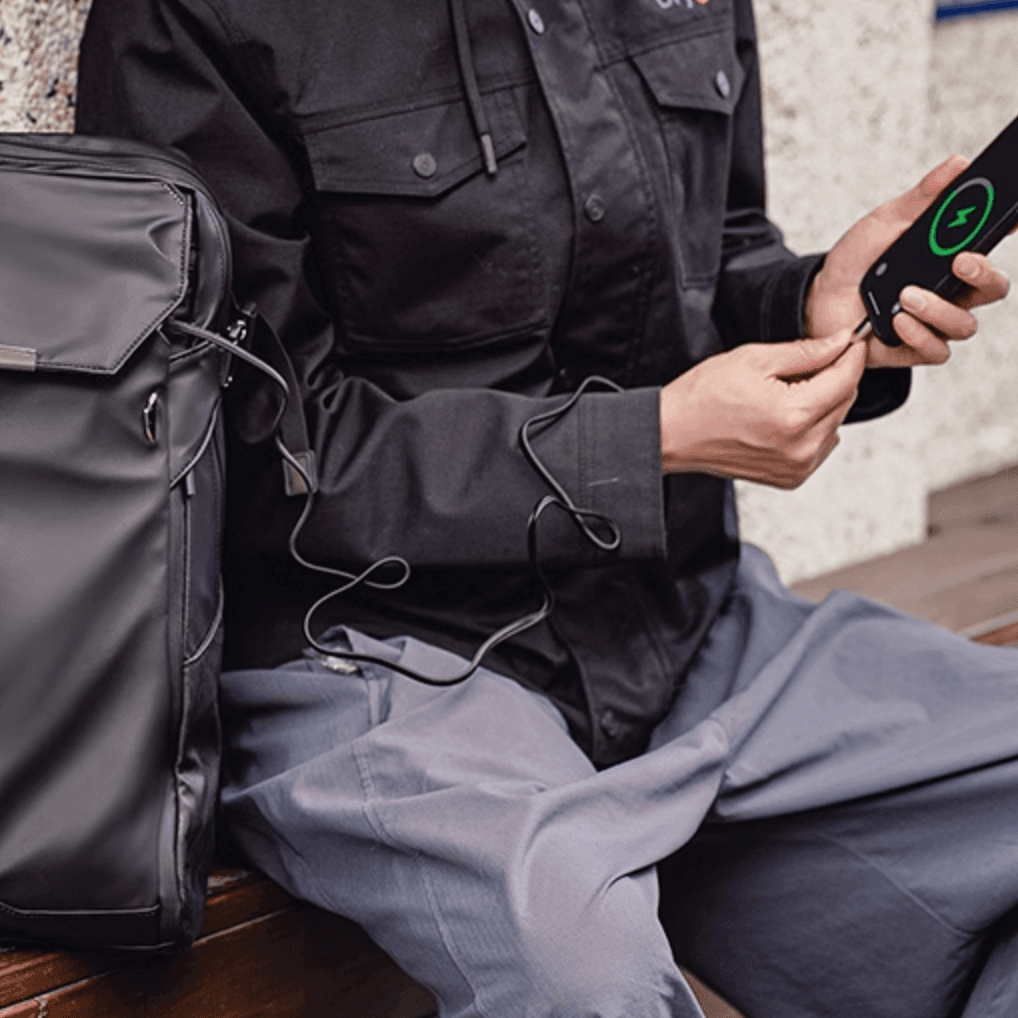 Gray GYXX™ Zues expandable motorcycle backpack by Bean's Moto Booth with multiple compartments and adjustable straps.