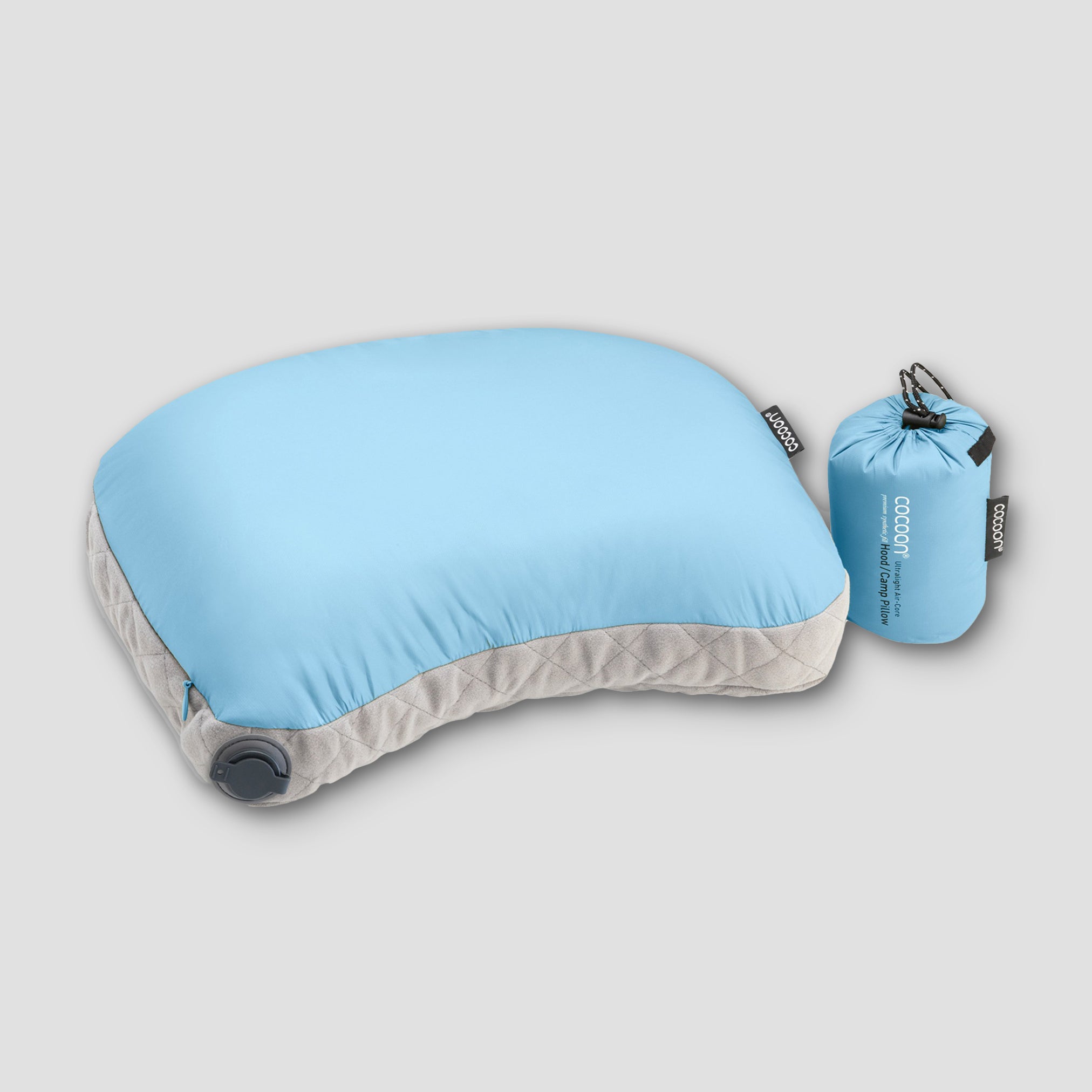 COCOON Ultralight AirCore Hood Pillow showing its lightweight design and adjustable hood for travel comfort.