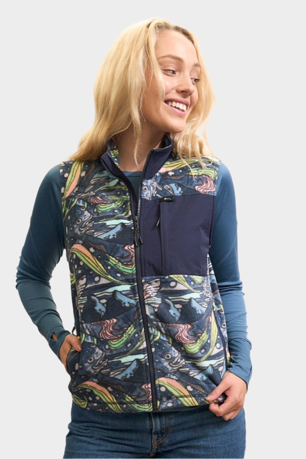 FisheWear HaliBorealis fleece vest in blue, lightweight and warm, displayed on a hanger with a full front view.