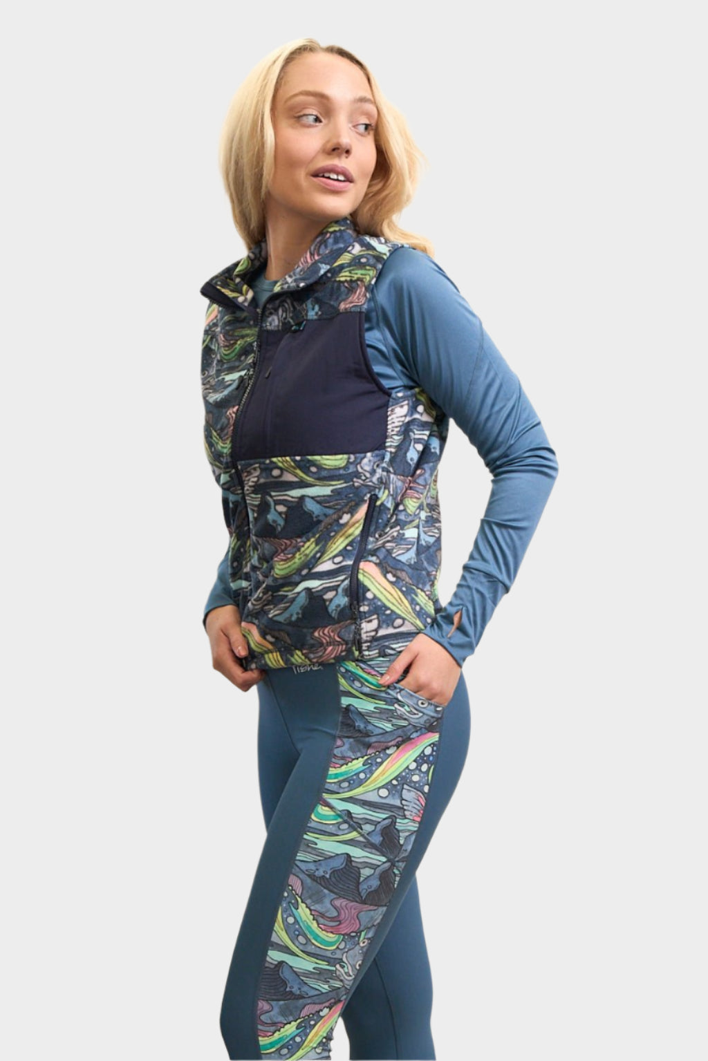 FisheWear HaliBorealis fleece vest in vibrant colors, featuring a soft fleece fabric and a quilted design for outdoor warmth and comfort.