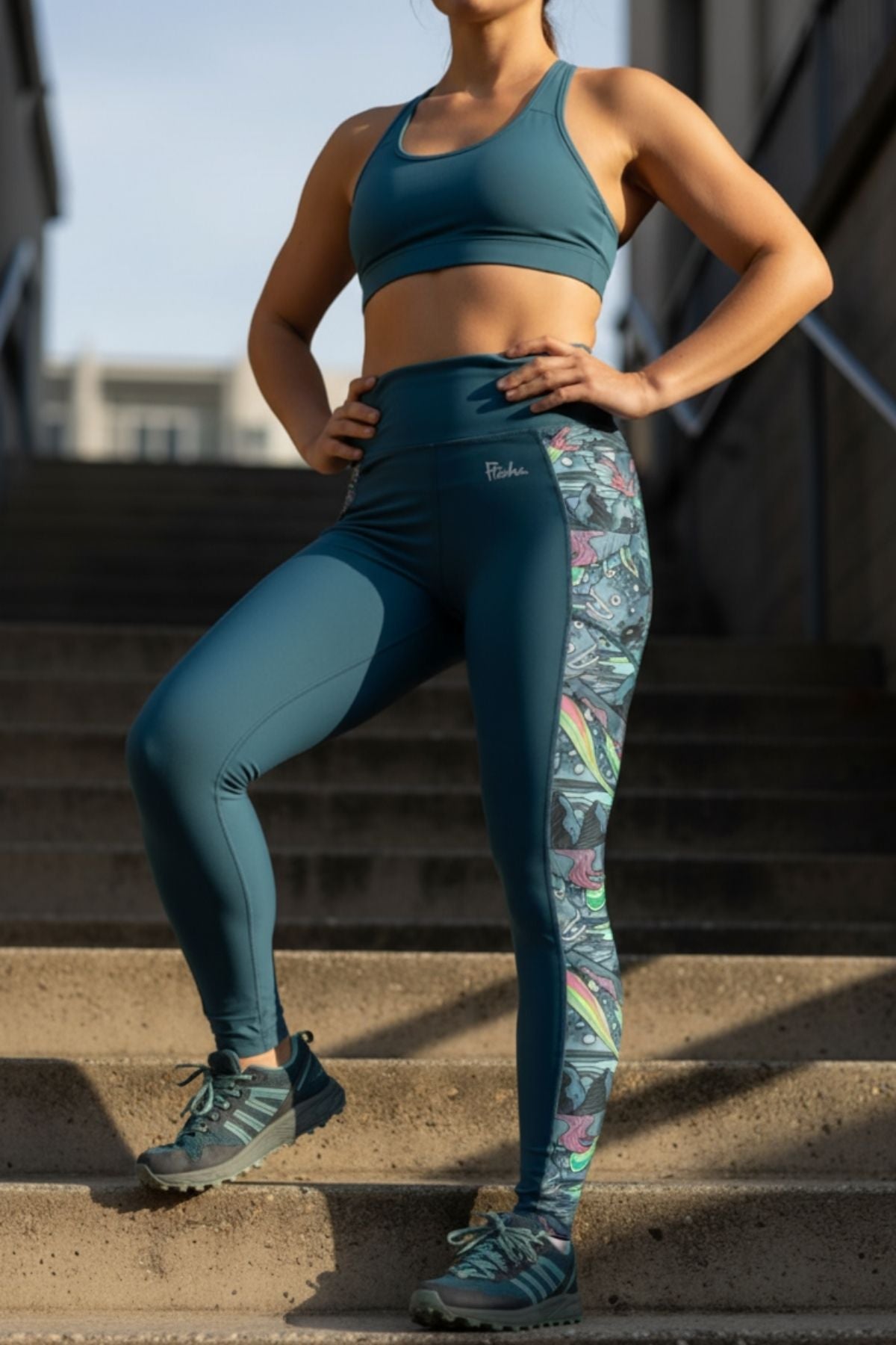 FisheWear HaliBorealis Pocket Leggings featuring a vibrant, colorful geometric pattern and functional side pockets.