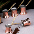 Handmade copper ibrik for Turkish coffee preparation, crafted by Tea + Linen with a traditional design and polished finish.