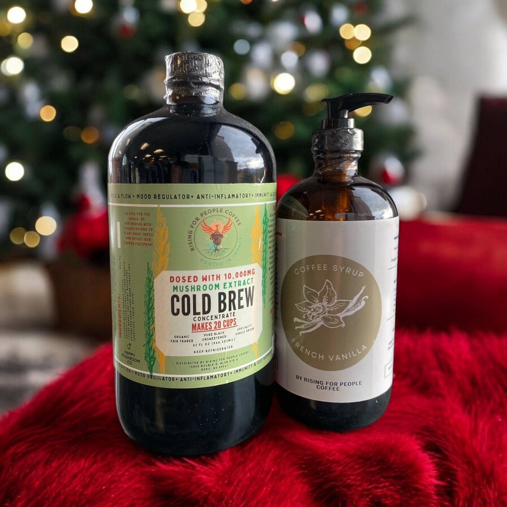 Happy Mushroom Cold Brew and French Vanilla Coffee Syrup by Rising For People Coffee Co., featuring a bottle of flavored coffee syrup.