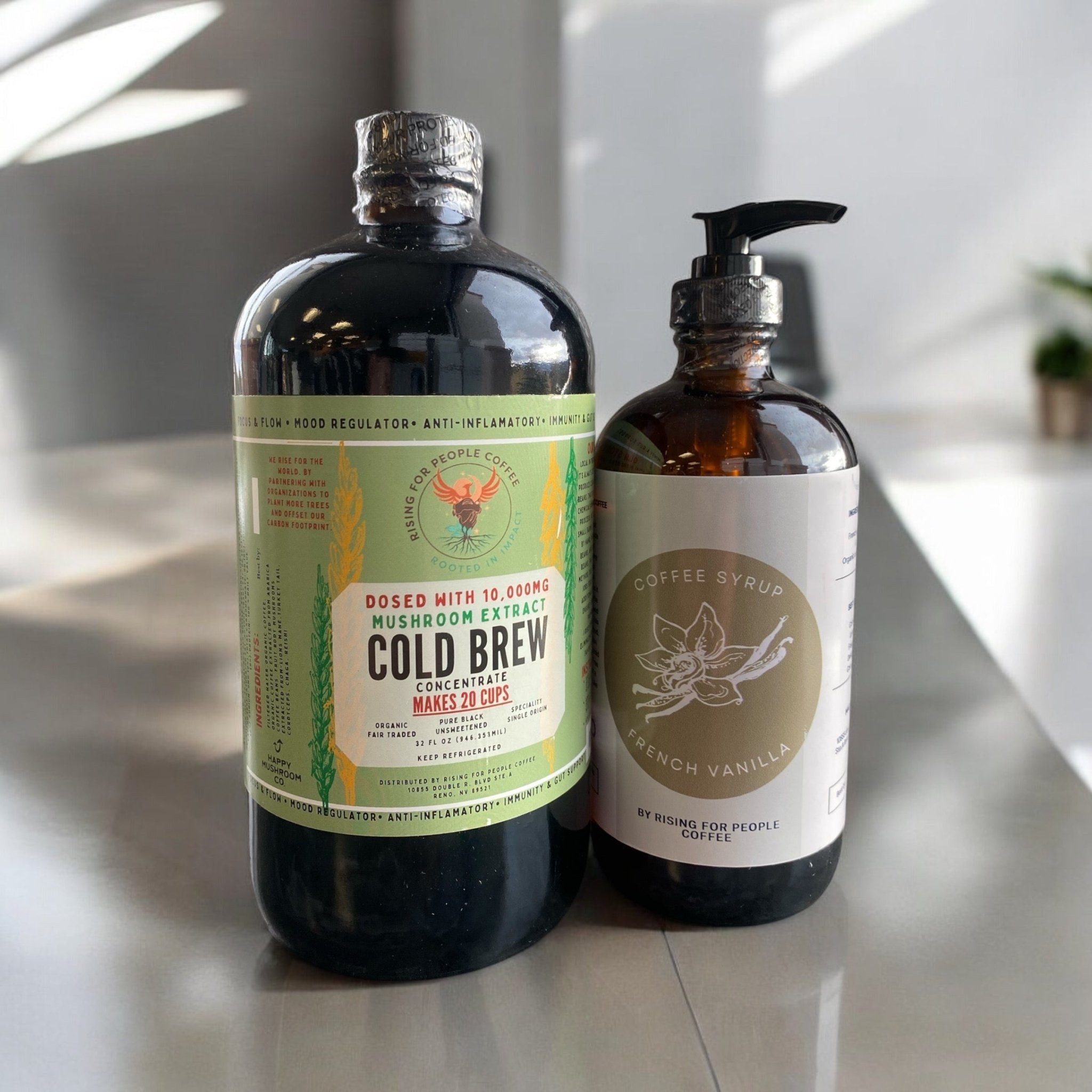 Happy Mushroom Cold Brew and French Vanilla Coffee Syrup from Rising For People Coffee Co. in a clear glass with syrup drizzled.