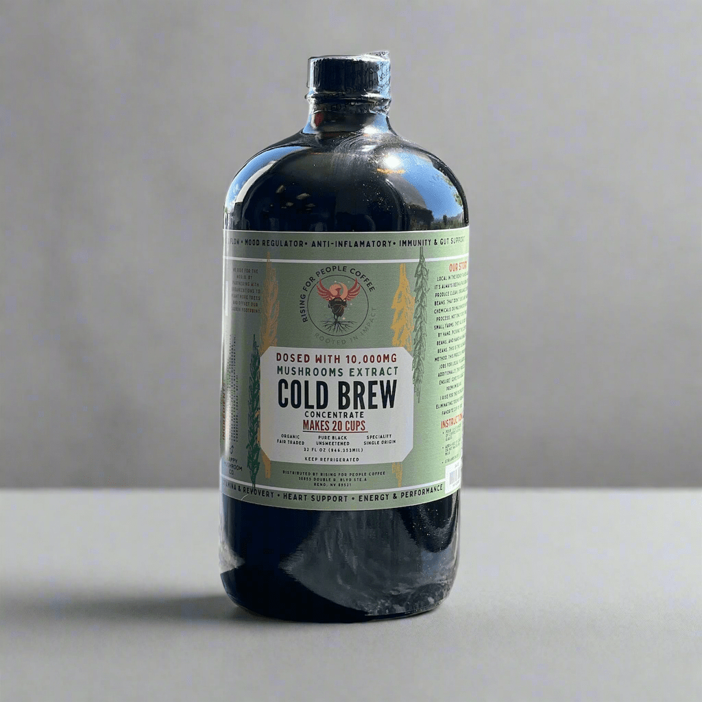 Happy Mushroom Cold Brew Coffee by Rising For People Coffee Co. in a glass bottle with a label featuring a mushroom illustration.