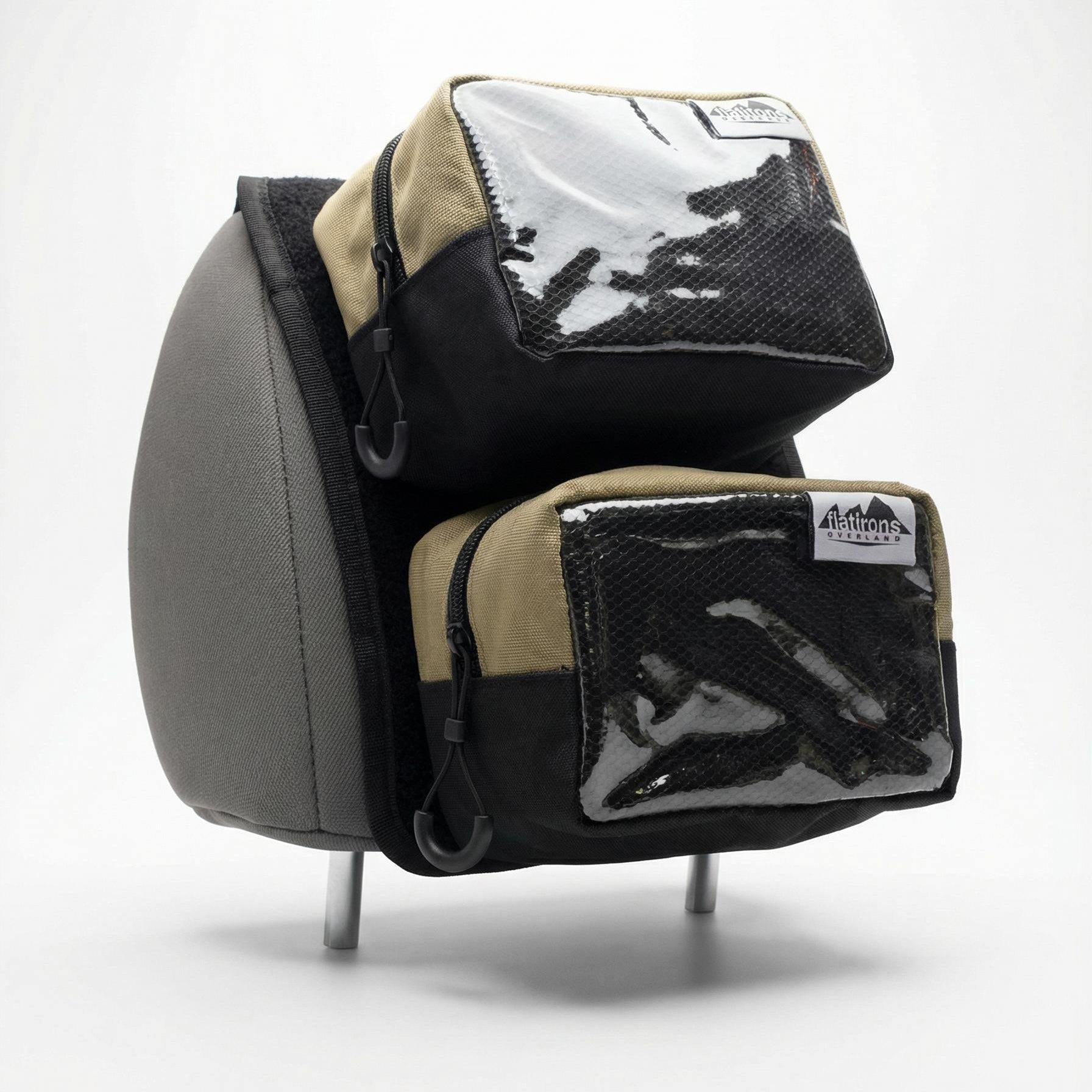 Flatirons Overland RiPouch™ Headrest Organizer attached to car headrest, featuring multiple storage pockets for travel essentials.