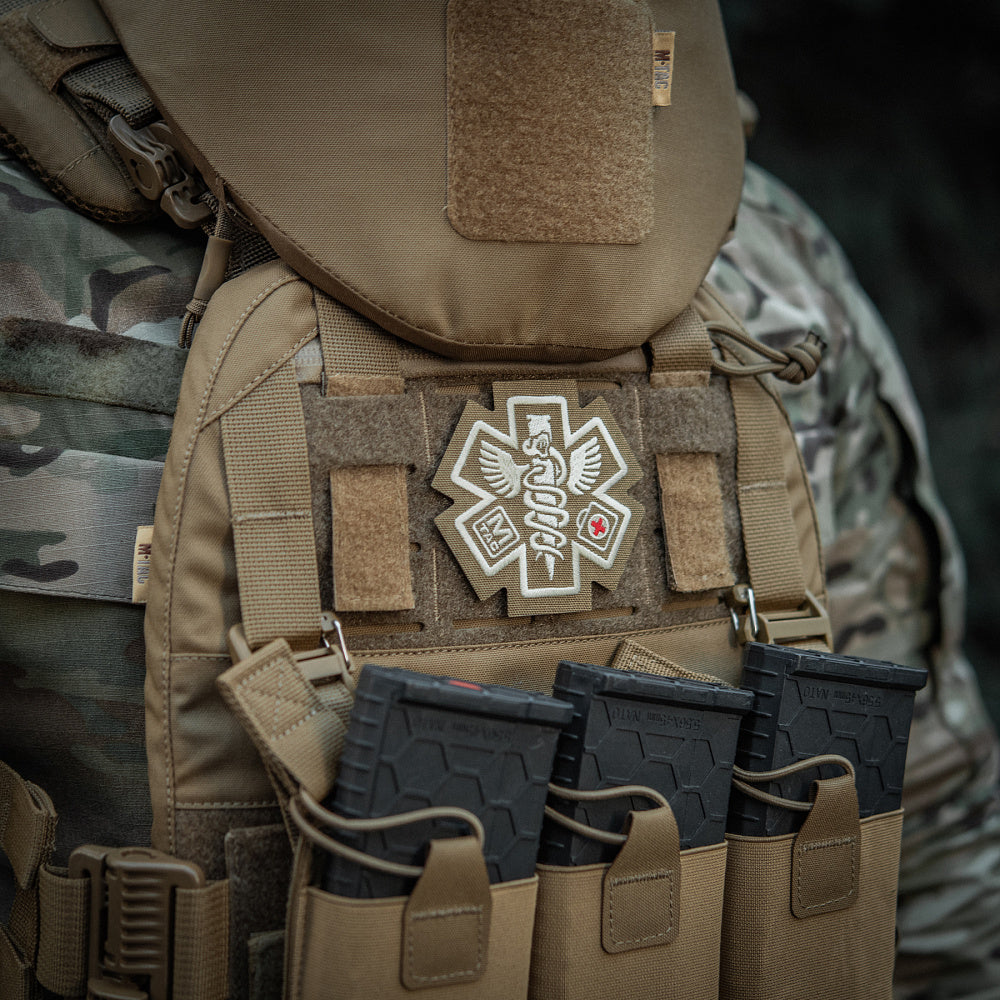 M-TAC Paramedic embroidered patch featuring bold red cross design on durable fabric background.