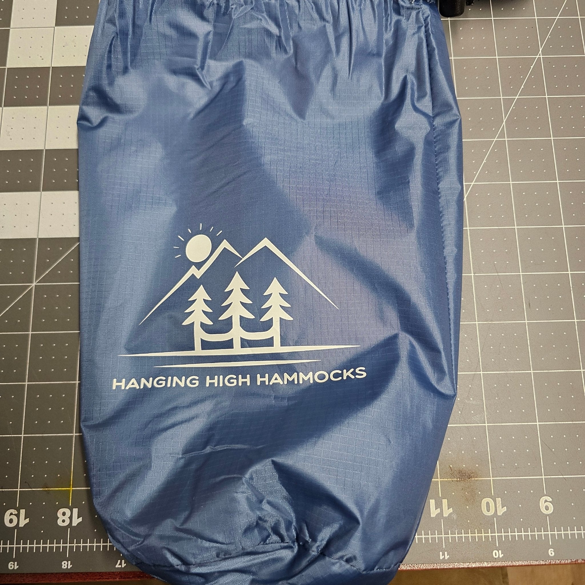 Hanging High Hammocks 12-foot Hideaway Tarp rain cover for hammocks, made of waterproof fabric, with grommets and reinforced edges.