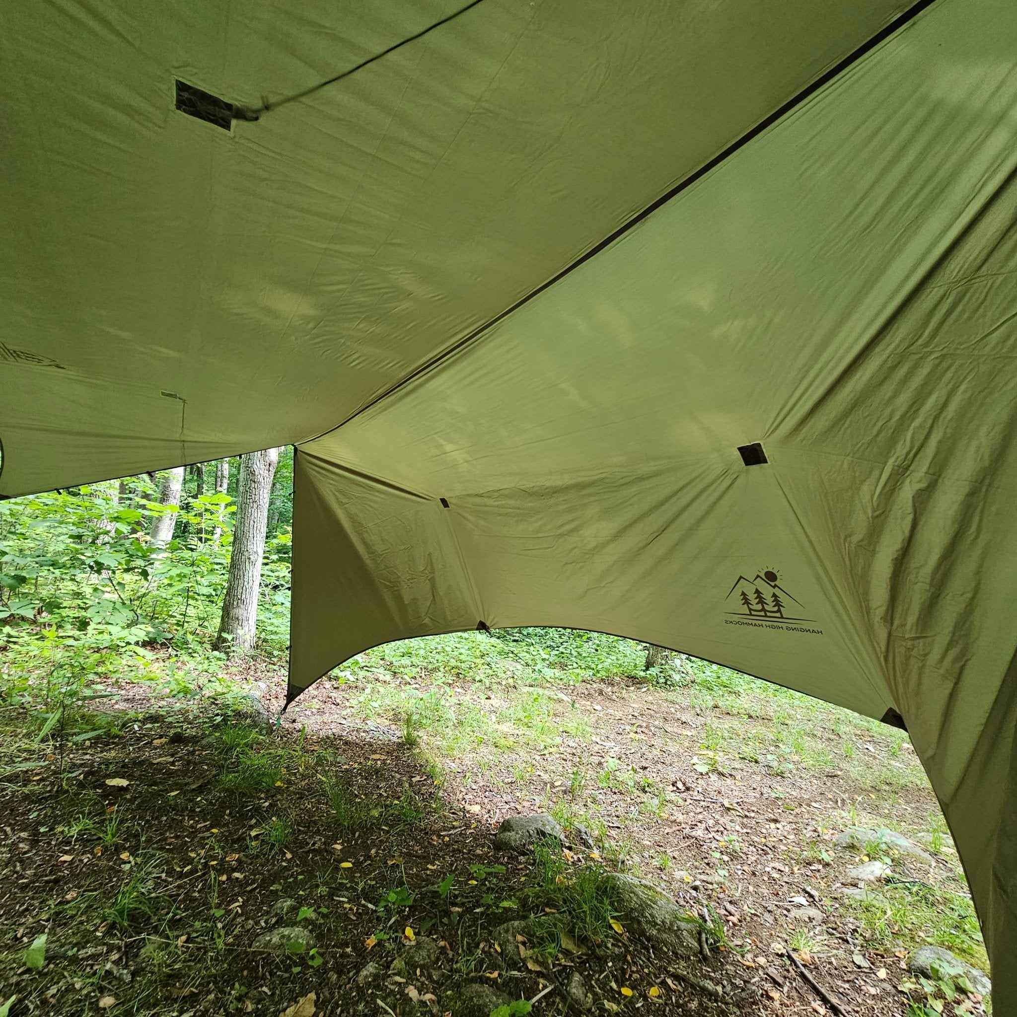 Hanging High Hammocks Hideaway Tarp for hammock camping, waterproof 12-foot rain tarp with adjustable support poles.