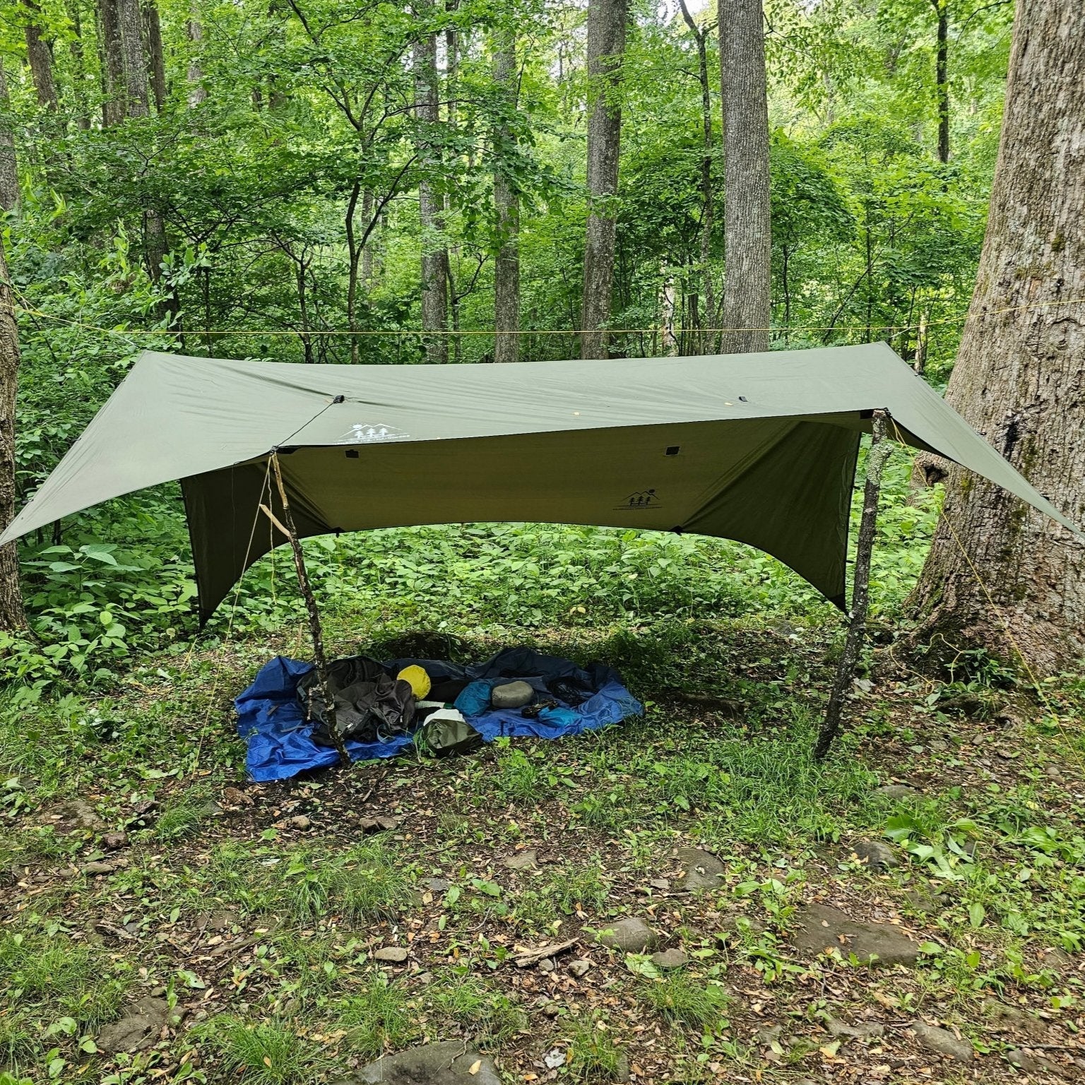 Lightweight Hideaway Tarp rain shelter from Hanging High Hammocks, designed for maximum coverage over a hammock.