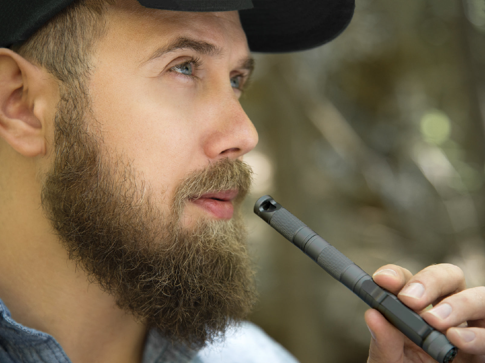 High-quality metal 5-in-1 survival tool with flint, whistle, and tactical pen features for outdoor emergencies and camping.