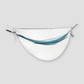 Ultralight COCOON mosquito net for hammocks, shown draped over a hammock, providing protection from insects during outdoor sleep.