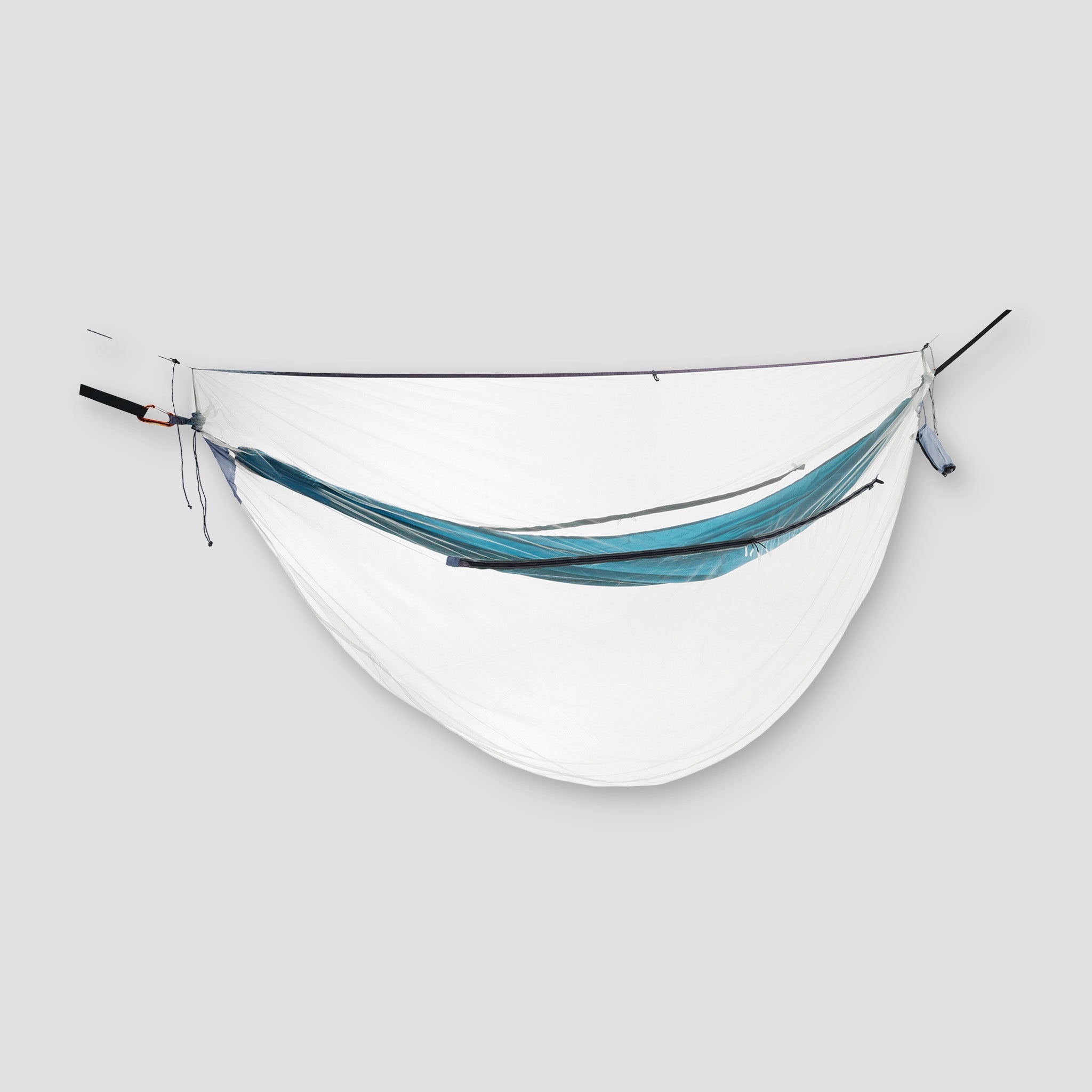 Ultralight COCOON mosquito net for hammocks, shown draped over a hammock, providing protection from insects during outdoor sleep.