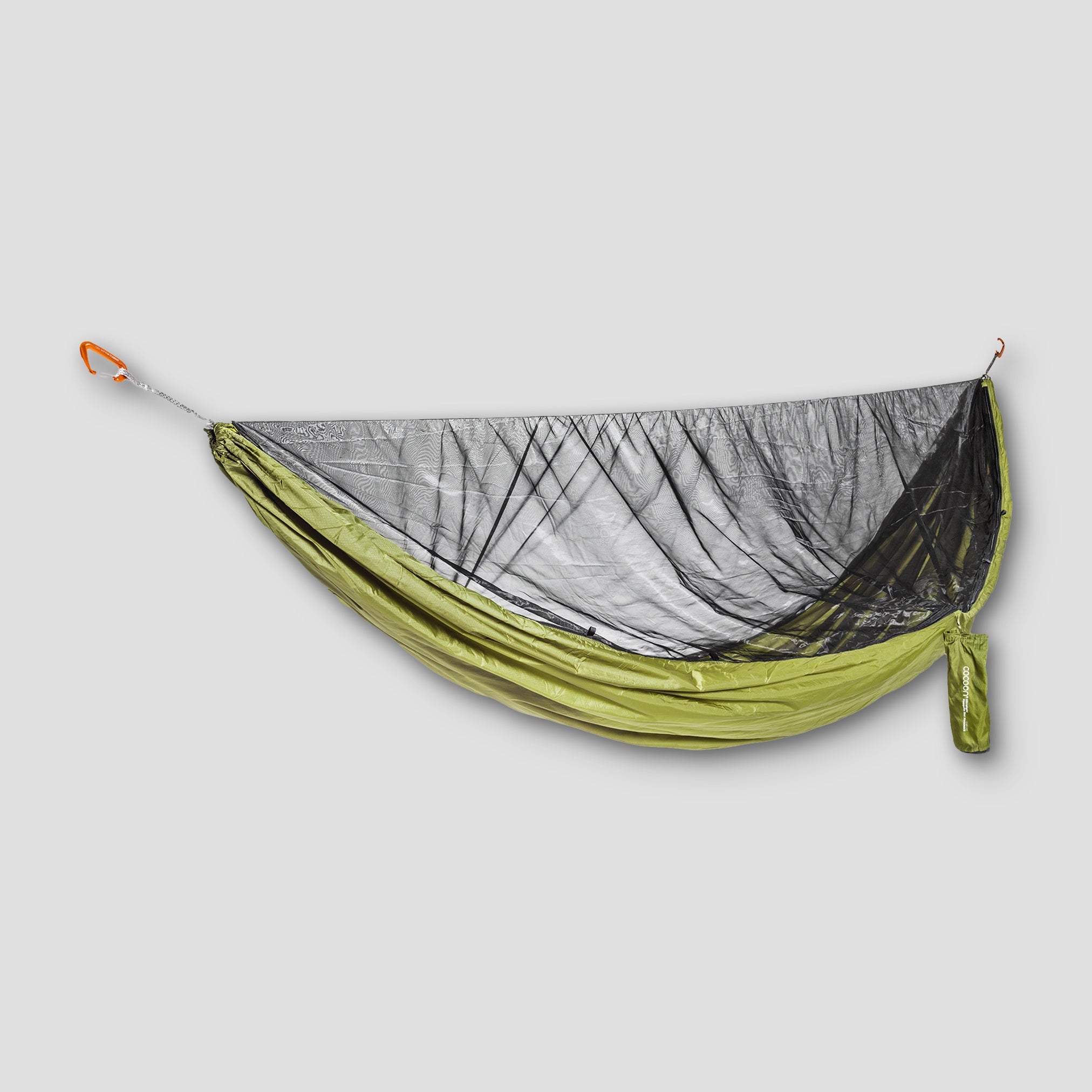COCOON ultralight mosquito net hammock hanging outdoors, showcasing its lightweight breathable mesh and compact design.