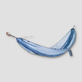 Ultralight COCOON Travel Hammock for single use, shown hanging outdoors with tree support, ideal for backpacking and camping.