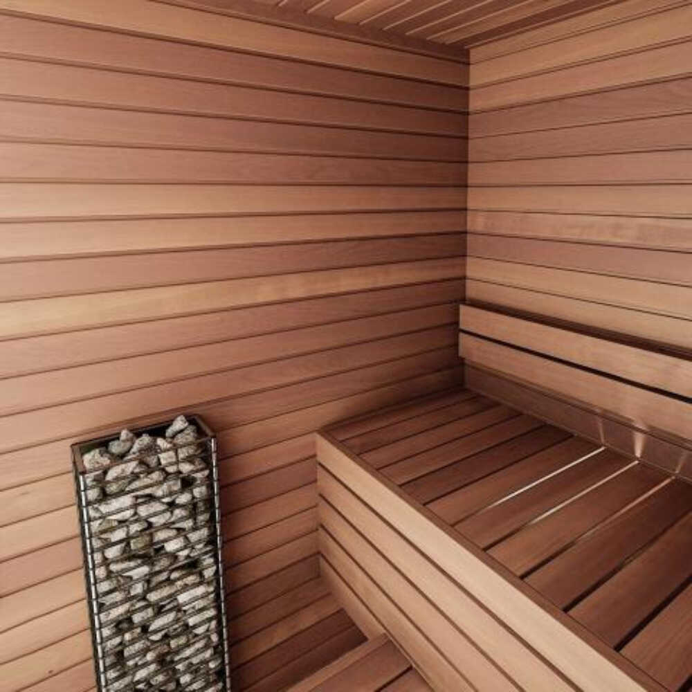 Huum Cliff Mini 4 3.5KW electric sauna heater with digital controller and sauna stones inside a sauna room.