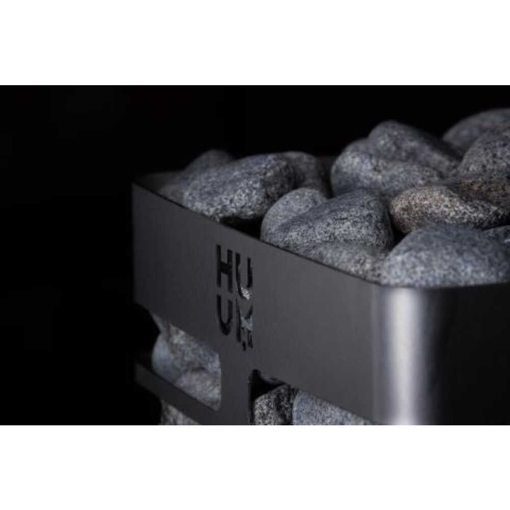 Huum Cliff Mini 4 3.5KW electric sauna heater with digital controller and sauna stones, designed for efficient heat and ease of use.