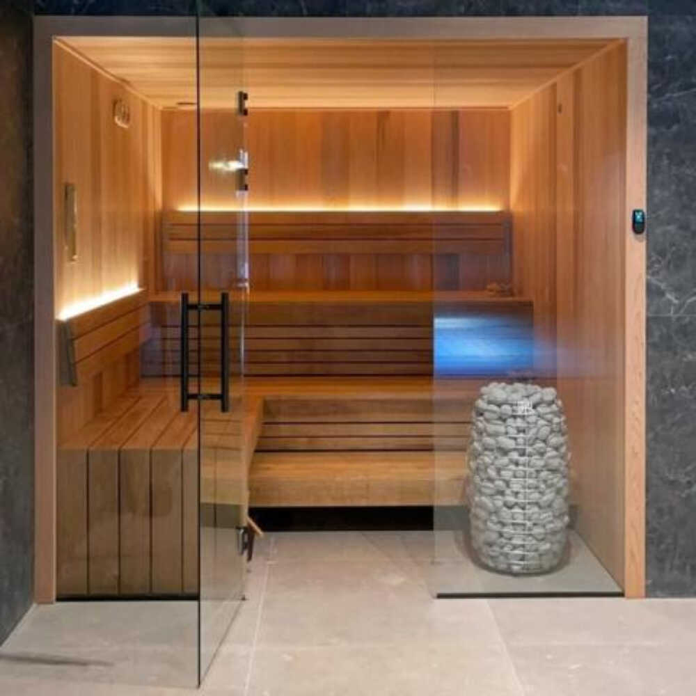Huum Hive Mini traditional steel sauna heater with digital controller and sauna stones, floor-mounted for SAKSBY WHOLESALE sauna room.