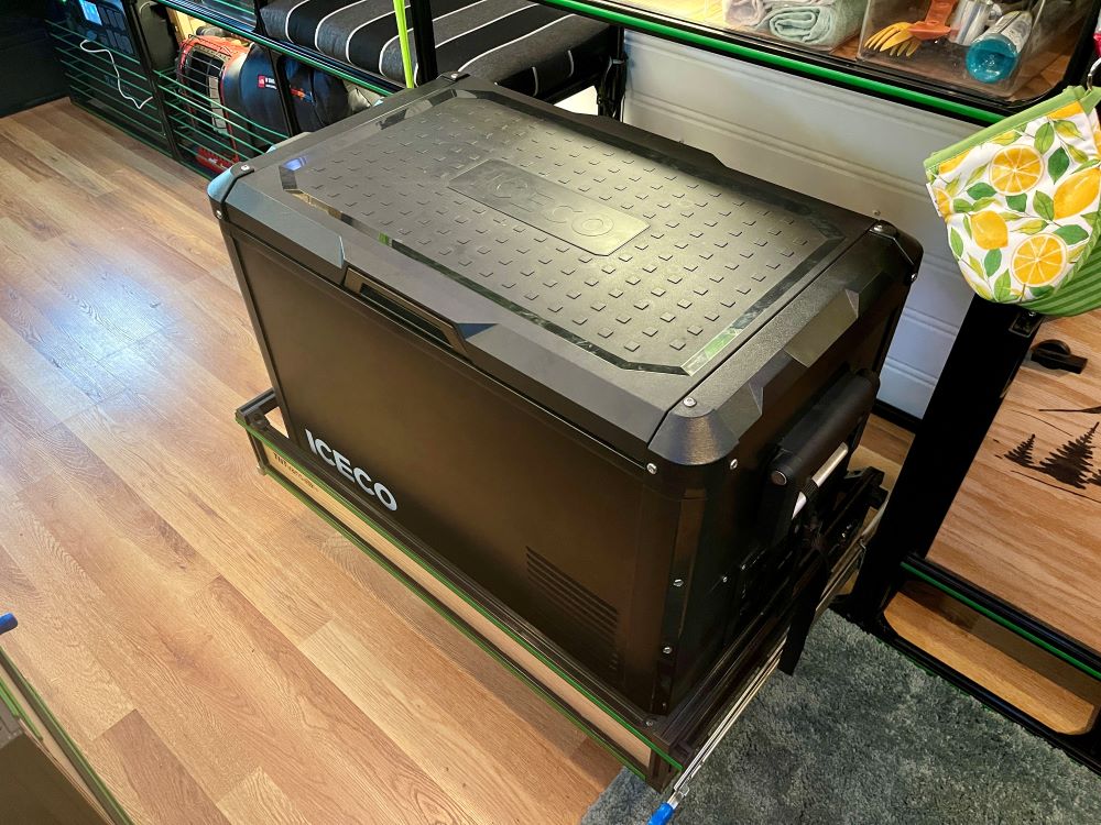 Sliding ice chest in a camper van kitchen setup for Mercedes Sprinter 170 DIY campervan conversion by TNTvans