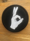 Redemption Tactical Circle Game patch featuring a round design with tactical graphics and bold lettering for military or gaming apparel