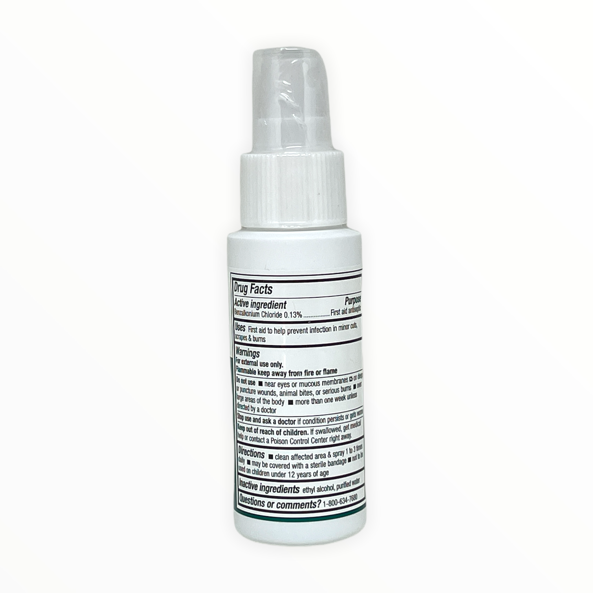 Medique antiseptic spray pump bottle for first aid supplies on a neutral background.