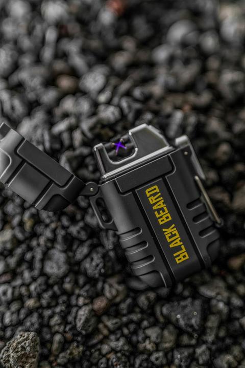 Black Beard Arc Lighter by Alpenglow Readiness Supply, featuring a sleek black design for outdoor use.