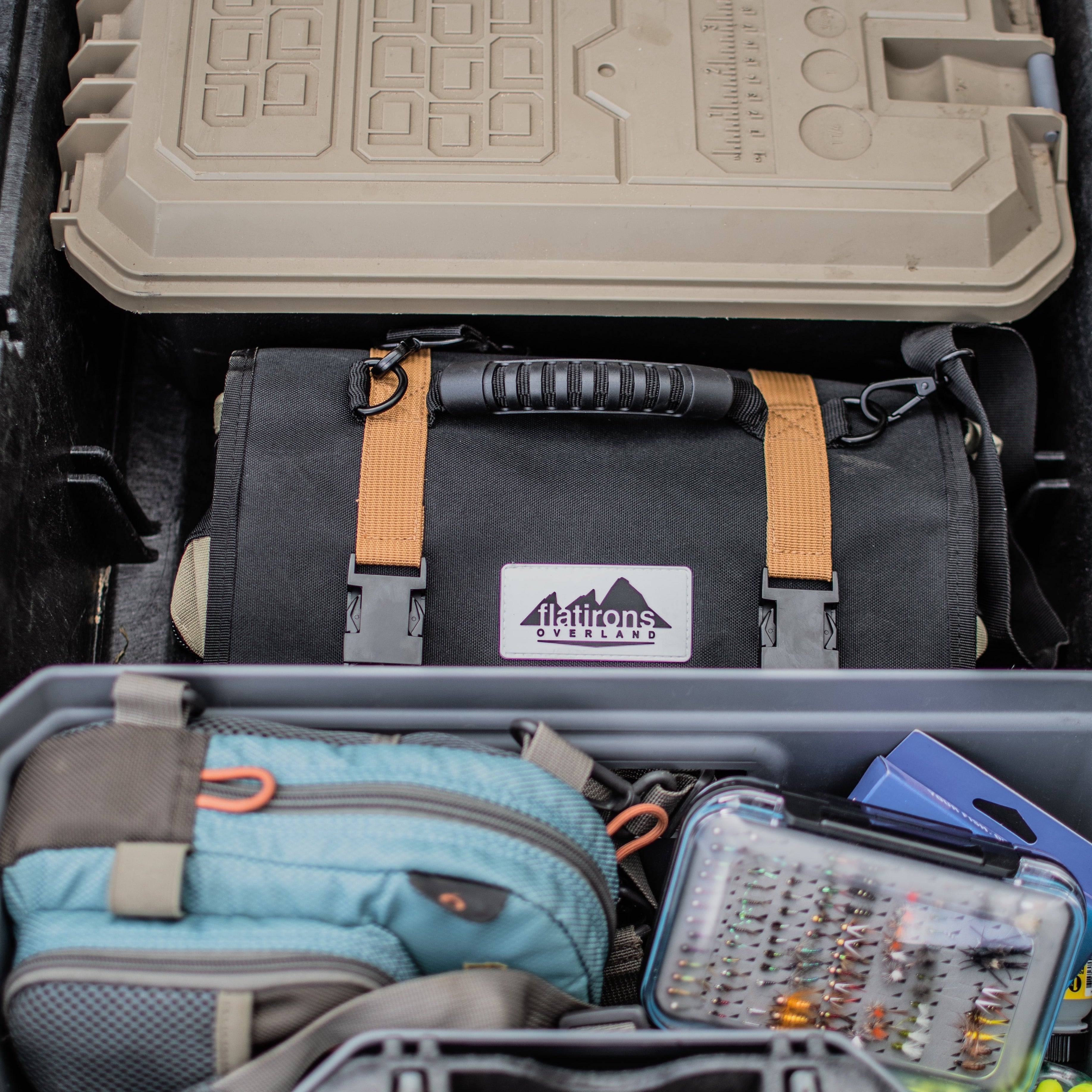 Flatirons Overland RiPouch™ Gear Roll with multiple compartments for organizing camping and outdoor gear, shown rolled up.