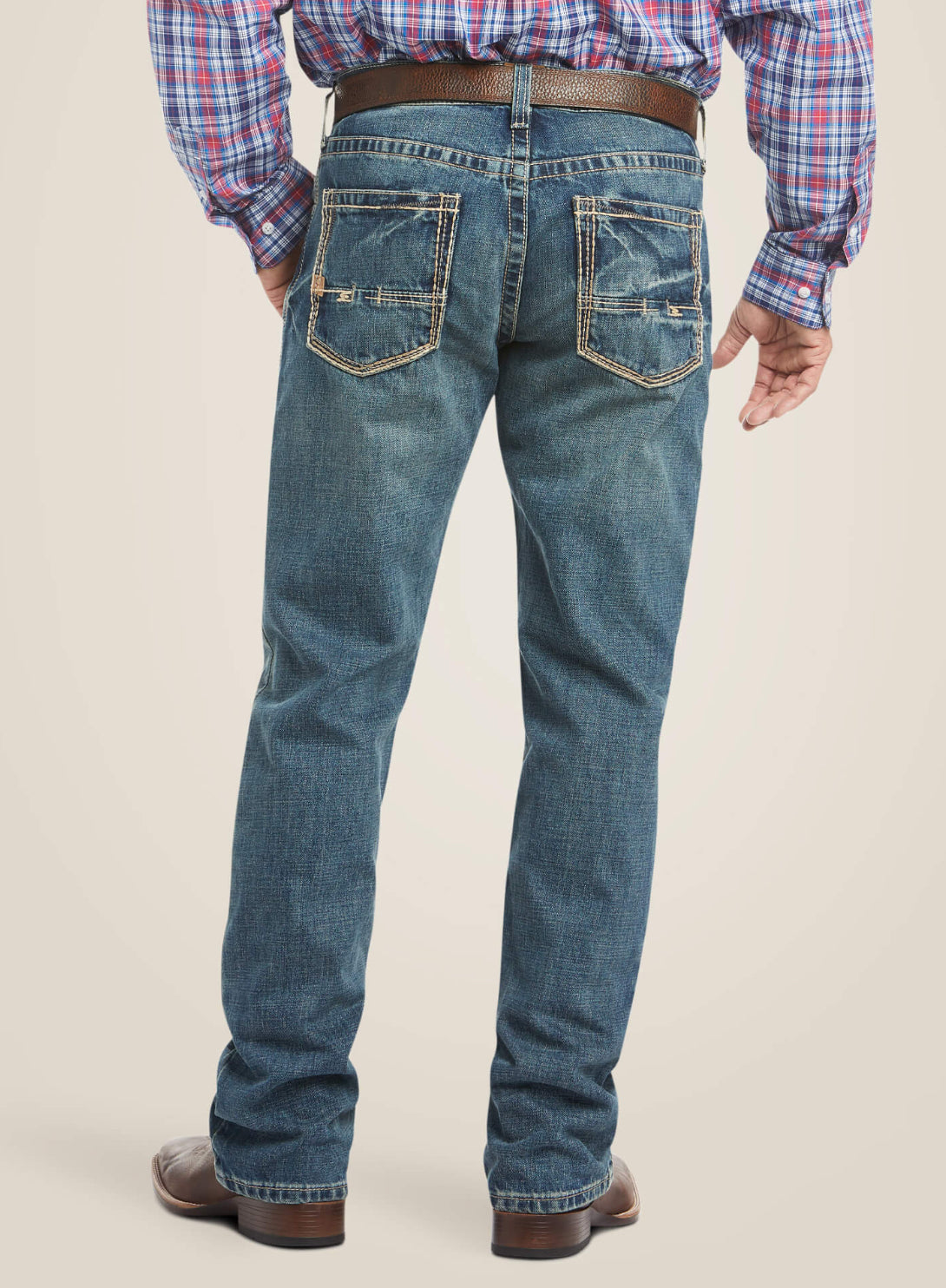 Ariat M4 Gulch Jean for men, casual blue denim jeans with classic fit and stitching, shown on a neutral background.
