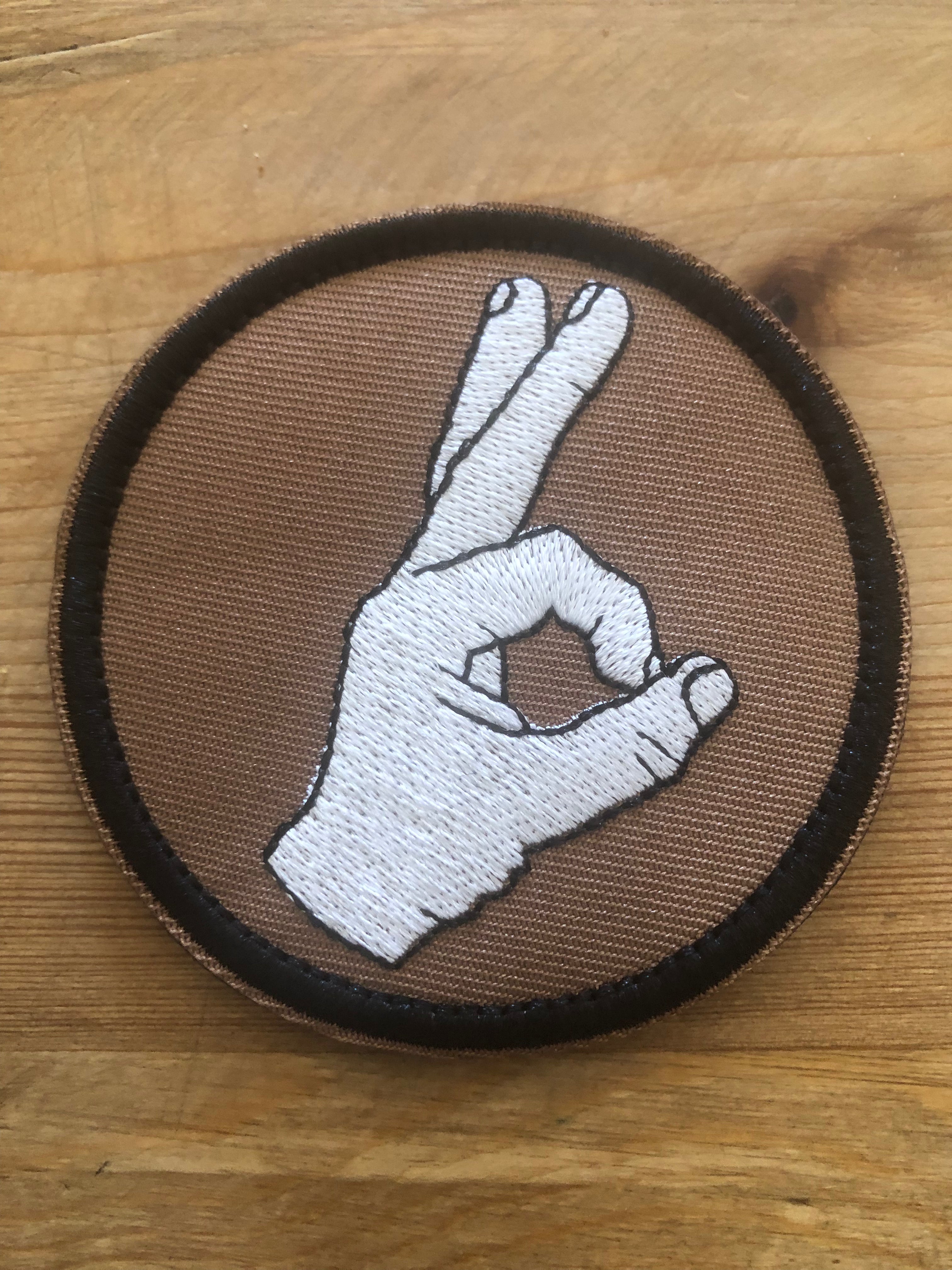 Redemption Tactical Circle Game patch featuring a circular design with tactical-themed graphics on fabric background.