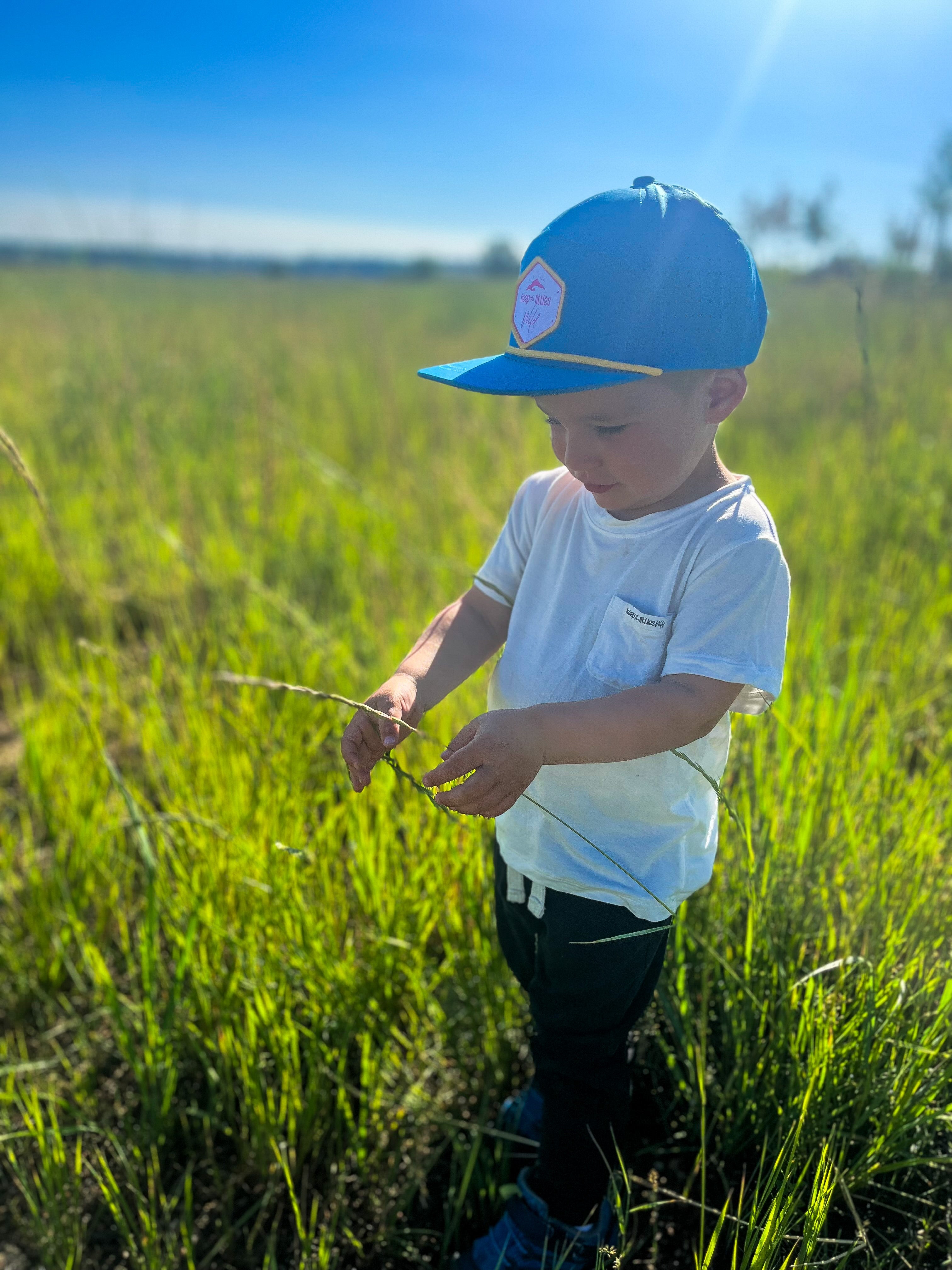 Bright Skies by Keep the Littles Wild, colorful and playful children's clothing featuring a vibrant sky-themed print.
