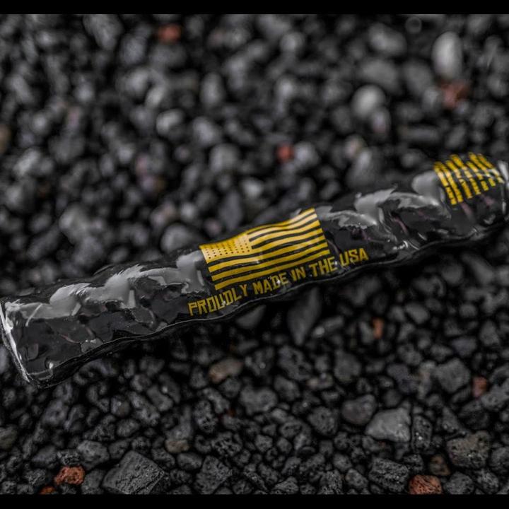 Black Beard Fire Starter by Alpenglow Readiness Supply, featuring a compact design for easy outdoor use.