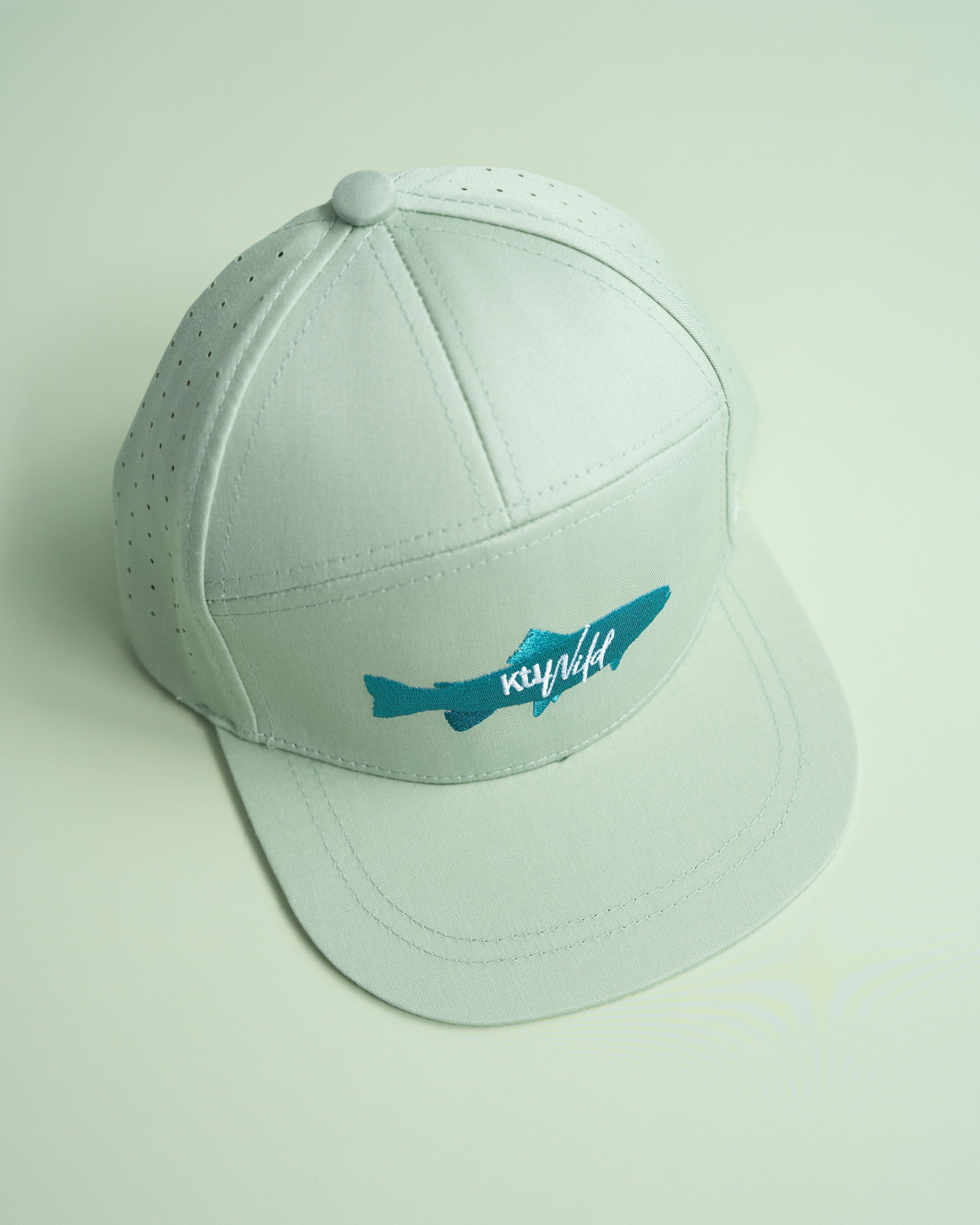 Keep the Littles Wild snapback hat called The Catch featuring a black and white design with embroidered logo and flat brim.