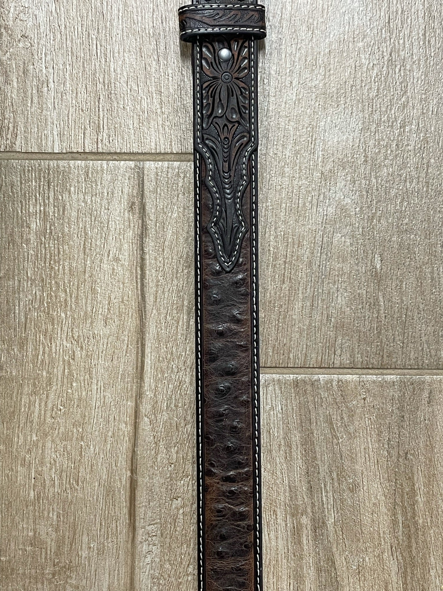 Ariat men's ostrich leather belt with Western-style buckle, brown color, casual accessory for Western or everyday wear.