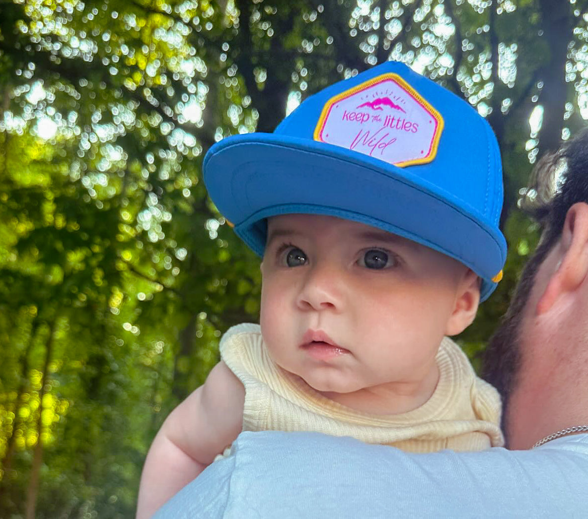 Bright Skies by Keep the Littles Wild featuring a vibrant, colorful sky-themed design on a children's clothing item.
