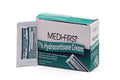 Medique Hydrocortisone Cream 1% in 0.9g tube, a first aid supply for skin irritation relief, displayed on a clean surface.
