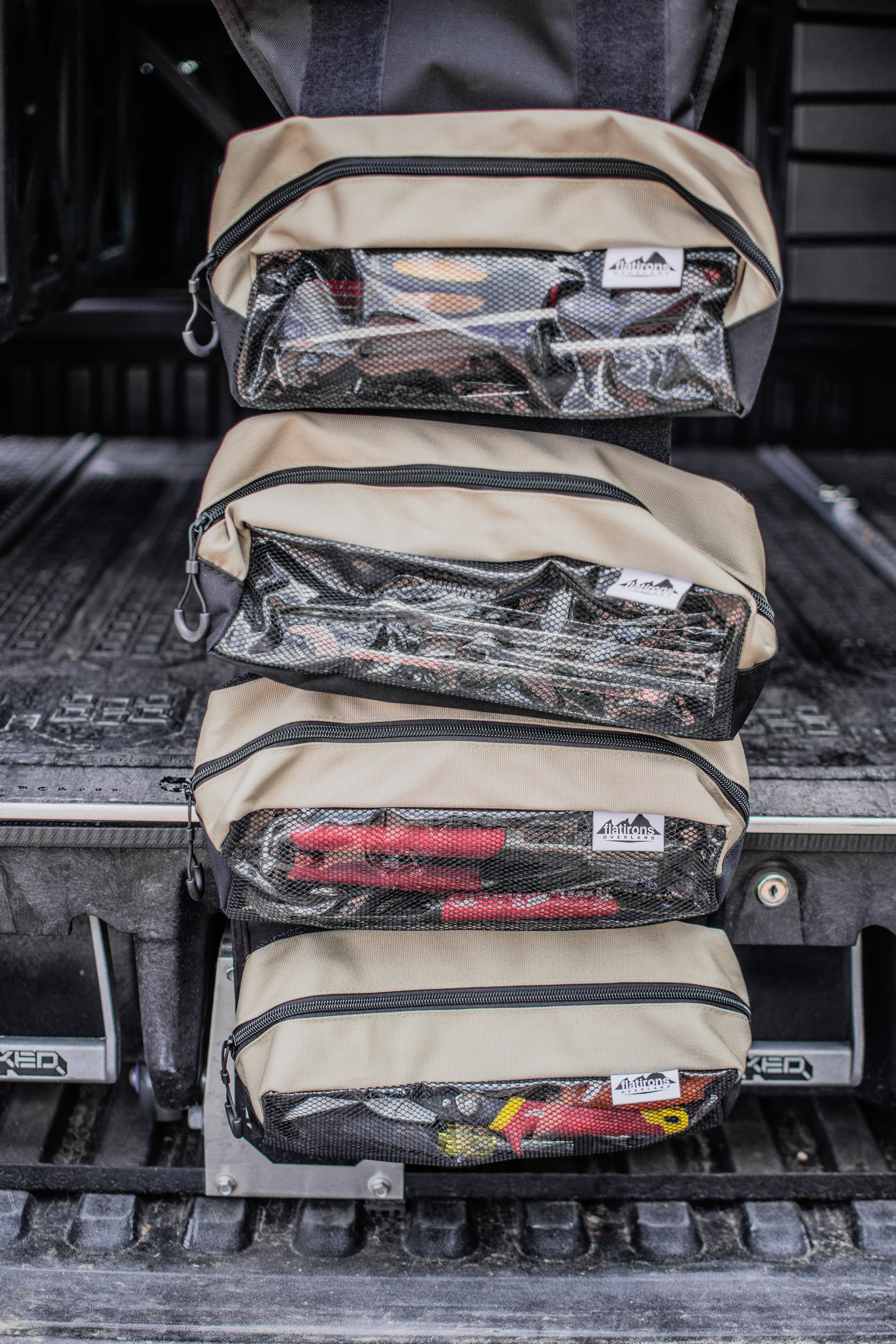 Flatirons Overland RiPouch™ Gear Roll with multiple compartments, durable fabric, and secure straps for organized outdoor gear storage.