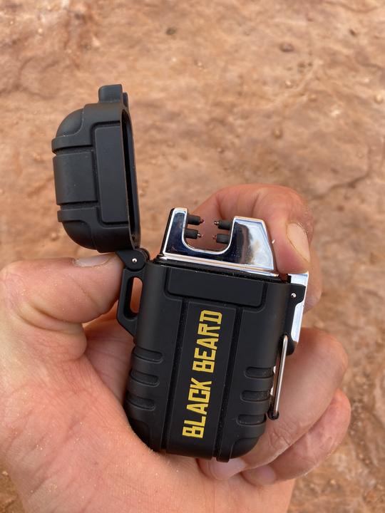 Black Beard Arc Lighter by Alpenglow Readiness Supply, featuring a sleek black design for outdoor use.