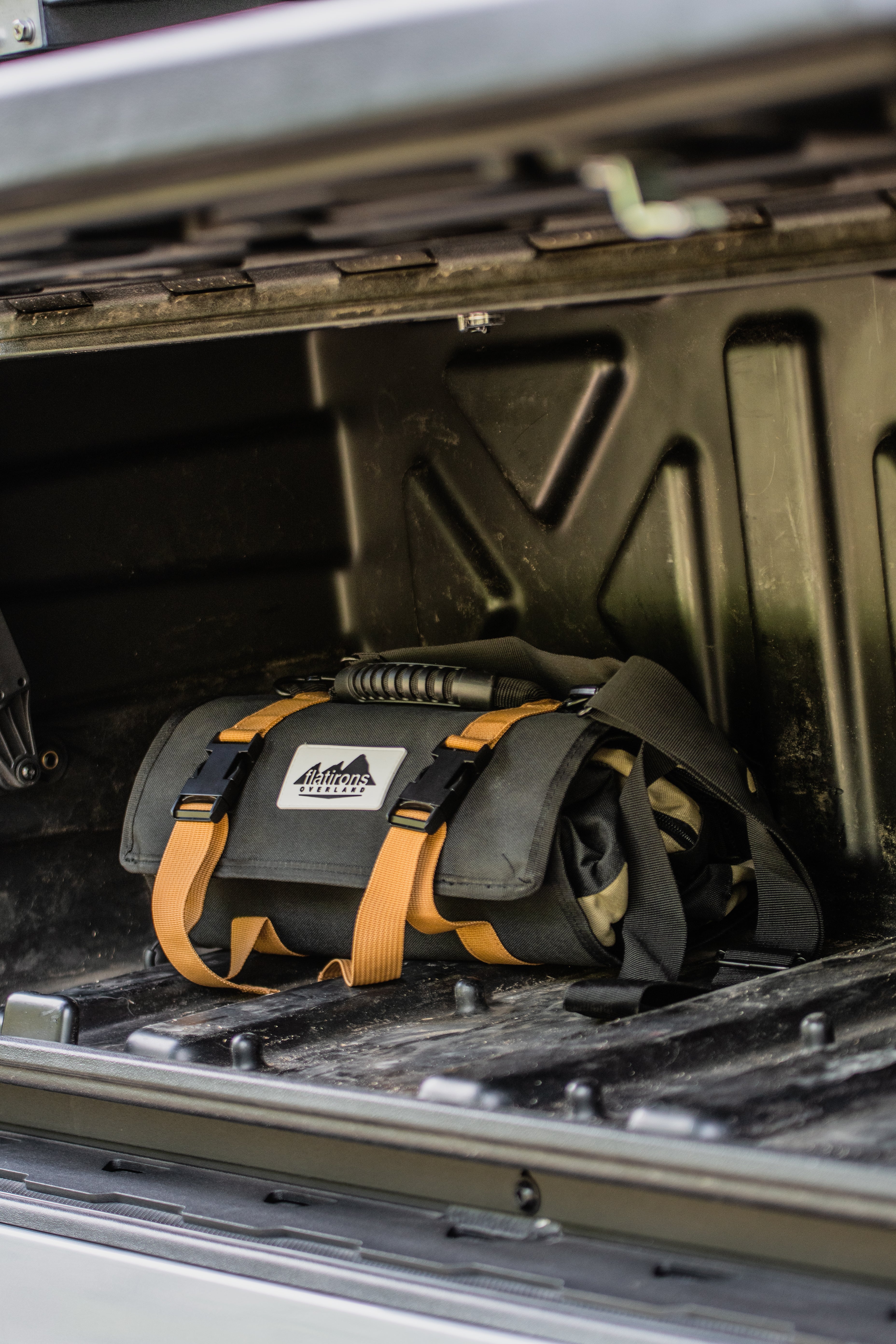 Flatirons Overland RiPouch™ Gear Roll with multiple compartments for organized outdoor gear storage in durable fabric.