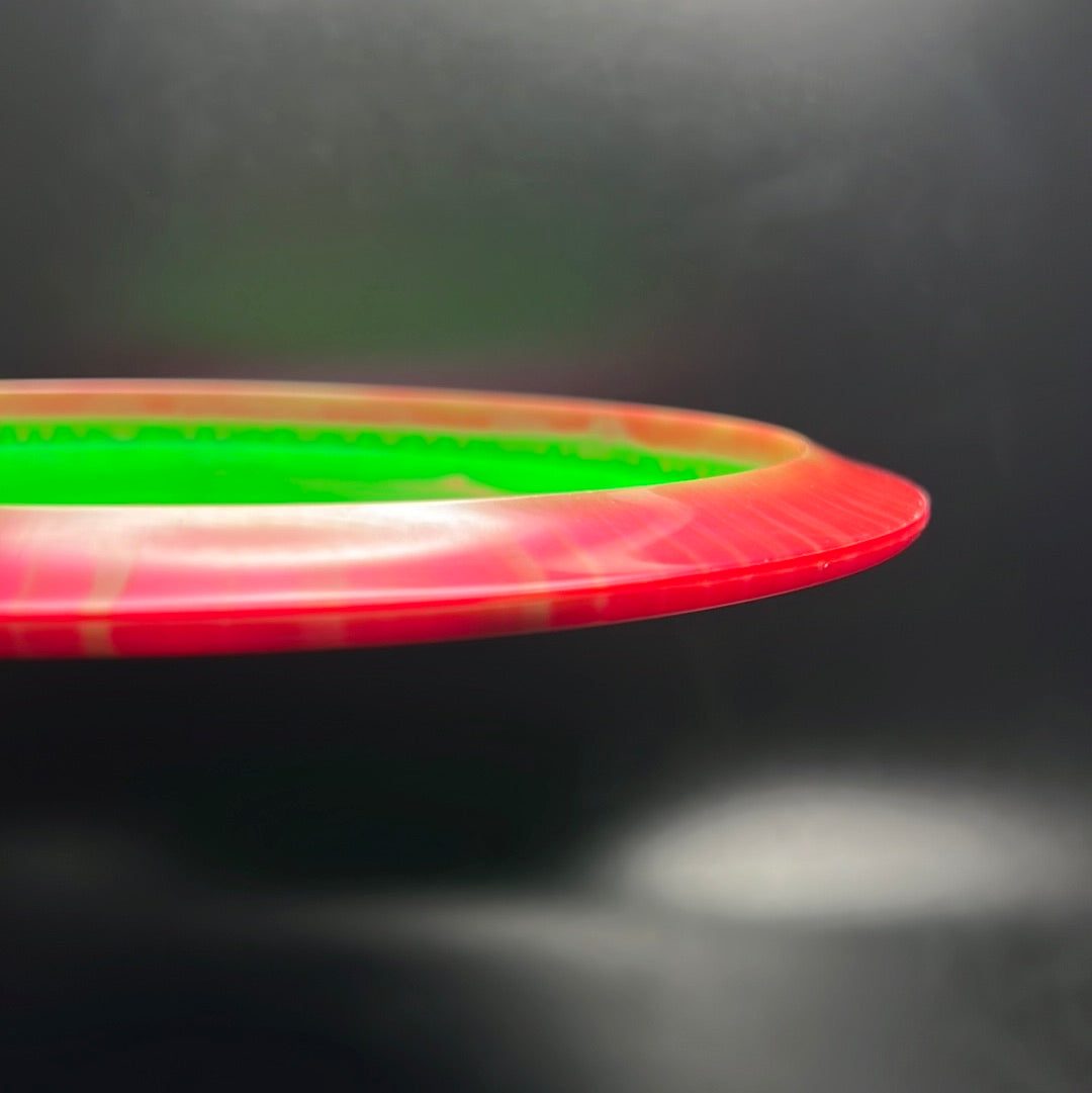 Rare Air Discs Halo S-Blend Exodus disc golf disc with custom RAD elk stamp, featuring vibrant colors and detailed design.