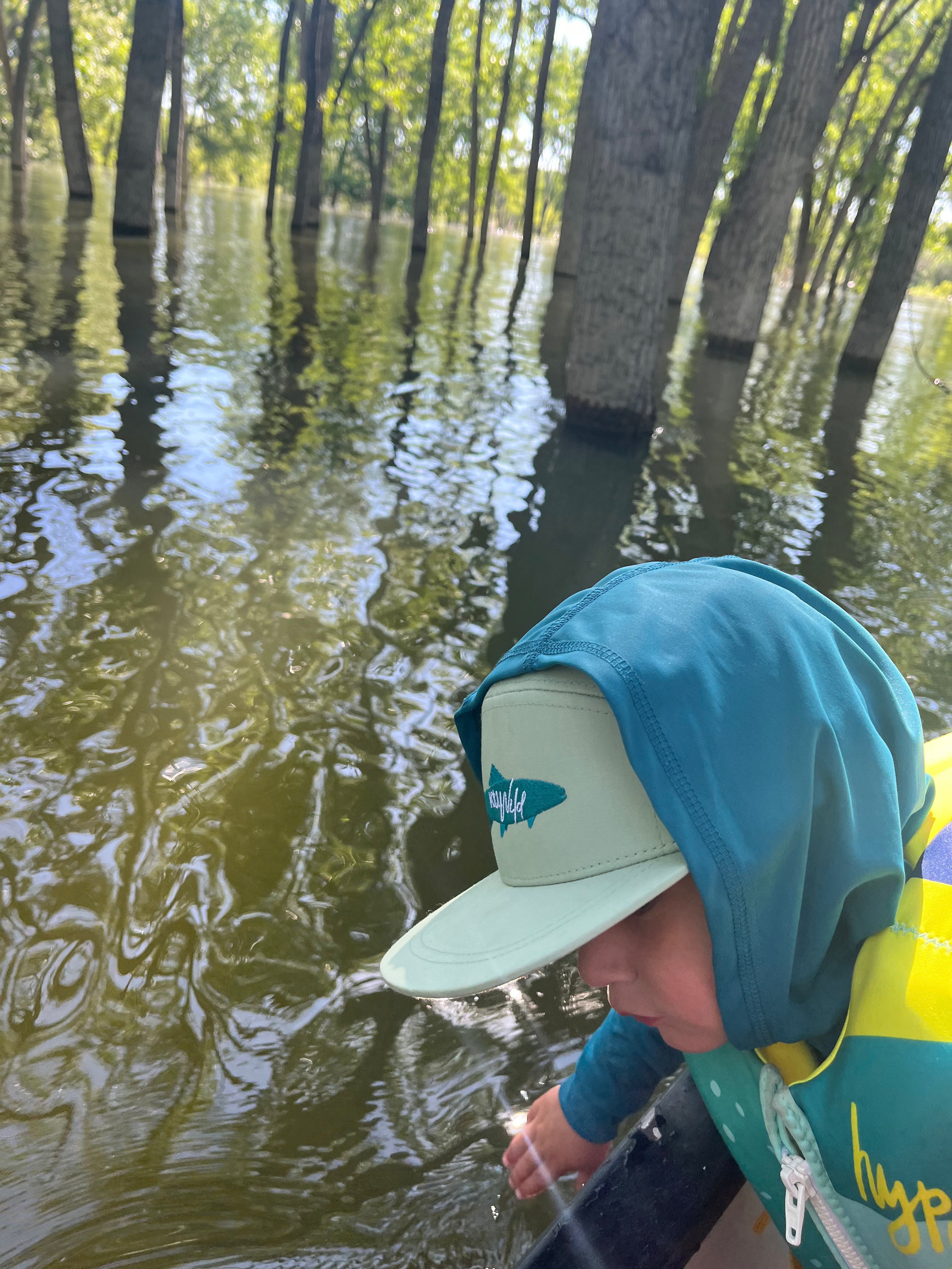 Keep the Littles Wild Snapback hat with "The Catch" embroidered design, featuring a black cap with colorful front lettering.