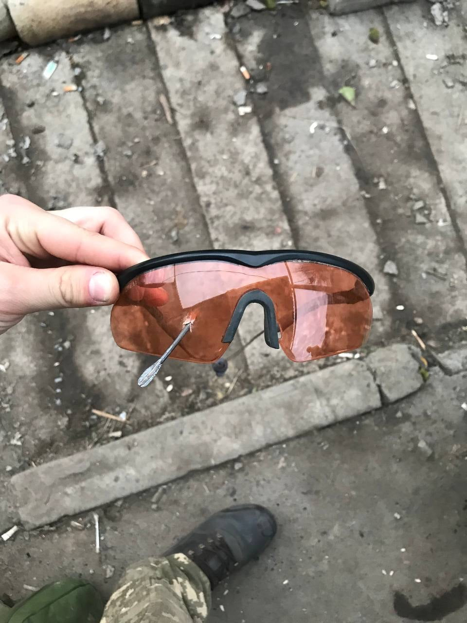 SwissEye Raptor ballistic sunglasses with sleek design and protective lenses against a neutral background.